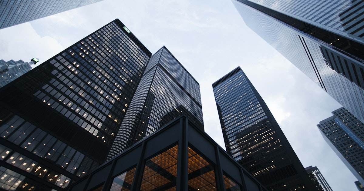 Modern company office building representing career page monitoring